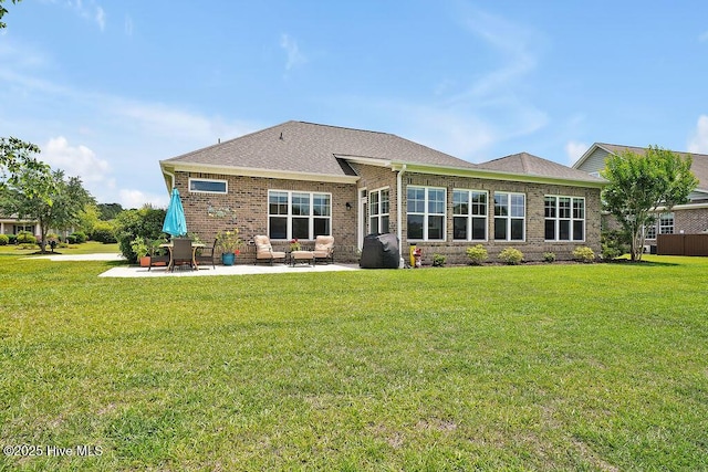 968 Woodwind Dr, Leland, NC 28451 - back of property featuring brick siding, a patio, a yard, and outdoor lounge area