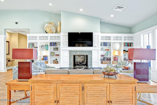 968 Woodwind Dr, Leland, NC 28451 - living area featuring vaulted ceiling, a premium fireplace, recessed lighting, and wood finished floors