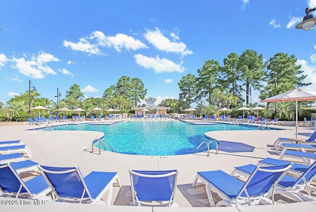 968 Woodwind Dr, Leland, NC 28451 - community pool featuring a patio area