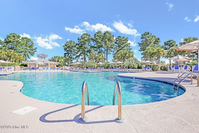 968 Woodwind Dr, Leland, NC 28451 - community pool with a patio area