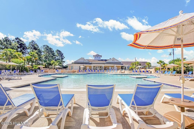 968 Woodwind Dr, Leland, NC 28451 - community pool with a patio area