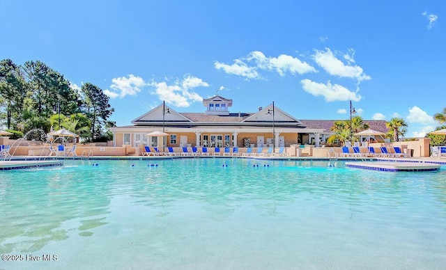 968 Woodwind Dr, Leland, NC 28451 - community pool with a patio