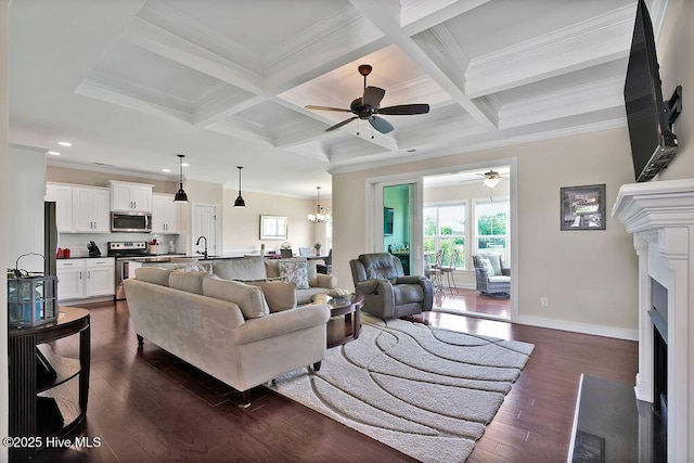 968 Woodwind Dr, Leland, NC 28451 - living room with ceiling fan, ornamental molding, plenty of natural light, a fireplace, and dark wood-style floors