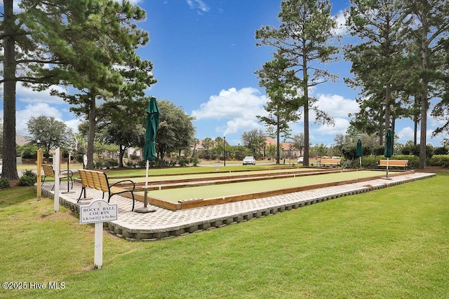 968 Woodwind Dr, Leland, NC 28451 - surrounding community with a game area and a lawn