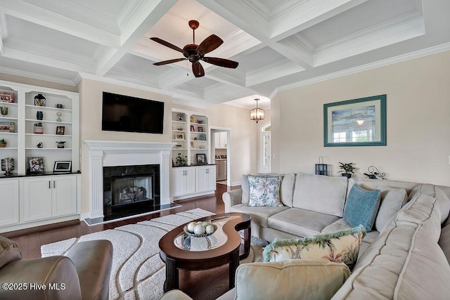 968 Woodwind Dr, Leland, NC 28451 - living room featuring dark wood-type flooring, ceiling fan, beamed ceiling, ornamental molding, and coffered ceiling