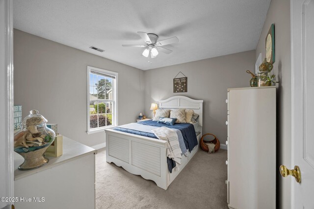 133 Moses Griffin Ln, New Bern, NC 28562 - bedroom with light carpet, ceiling fan, baseboards, and a textured ceiling