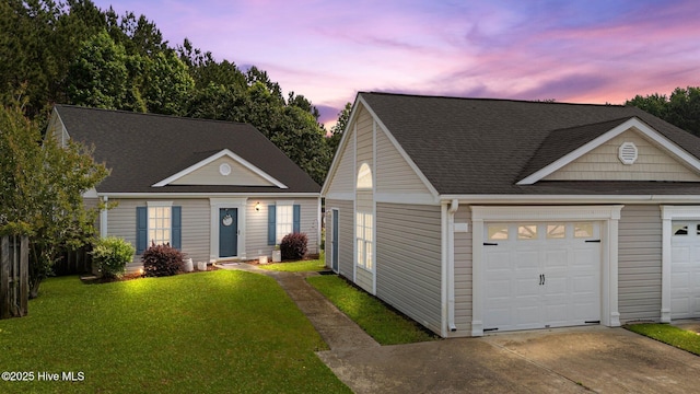 133 Moses Griffin Ln, New Bern, NC 28562 - view of front of home featuring a front yard, concrete driveway, and a shingled roof