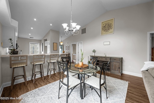 133 Moses Griffin Ln, New Bern, NC 28562 - dining space with vaulted ceiling, baseboards, a chandelier, wood finished floors, and recessed lighting