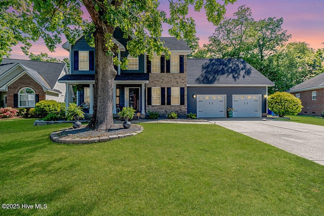 3508 Talus Rd, Fayetteville, NC 28306 - view of front of home featuring an attached garage, a yard, driveway, and a shingled roof