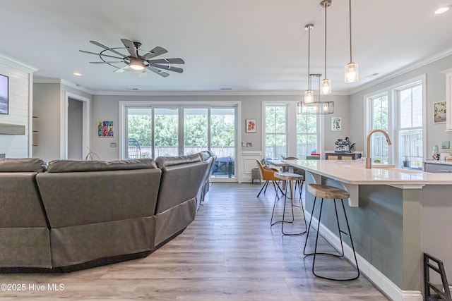 90 N Lamplighters Walk, Hampstead, NC 28443 - living room with ornamental molding, a ceiling fan, recessed lighting, and light wood-style floors