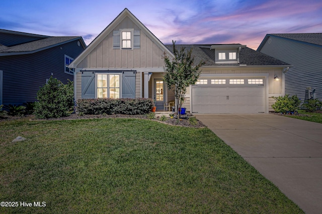90 N Lamplighters Walk, Hampstead, NC 28443 - view of front of property with board and batten siding, a garage, a lawn, driveway, and roof with shingles