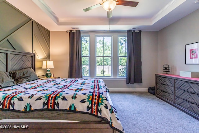 90 N Lamplighters Walk, Hampstead, NC 28443 - bedroom with a tray ceiling, carpet, crown molding, baseboards, and a ceiling fan