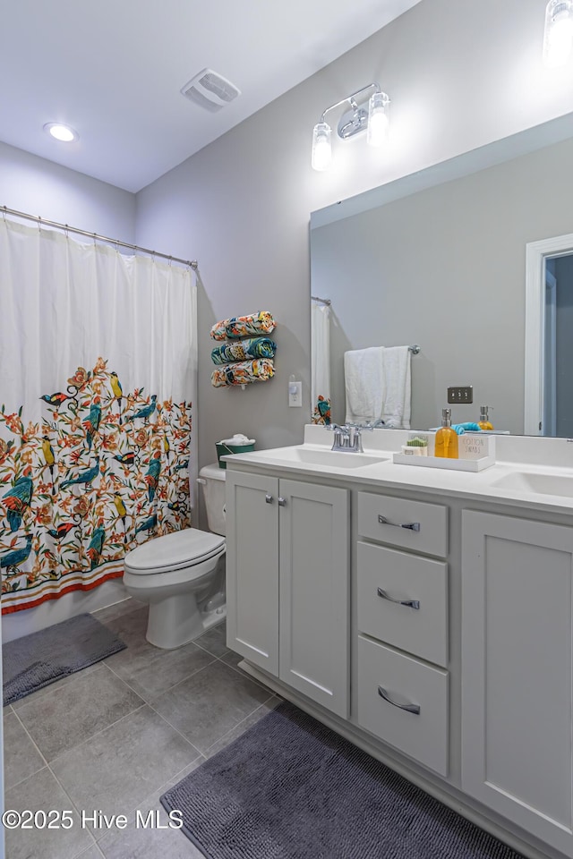 90 N Lamplighters Walk, Hampstead, NC 28443 - bathroom with double vanity, toilet, tile patterned flooring, and a shower with curtain