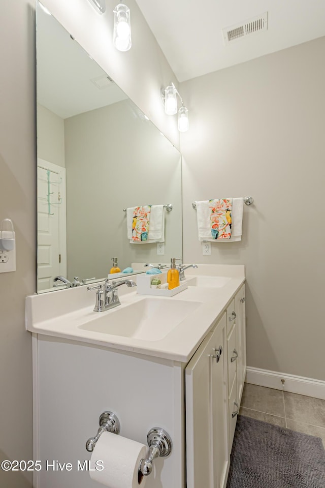 90 N Lamplighters Walk, Hampstead, NC 28443 - bathroom with double vanity, tile patterned flooring, and baseboards