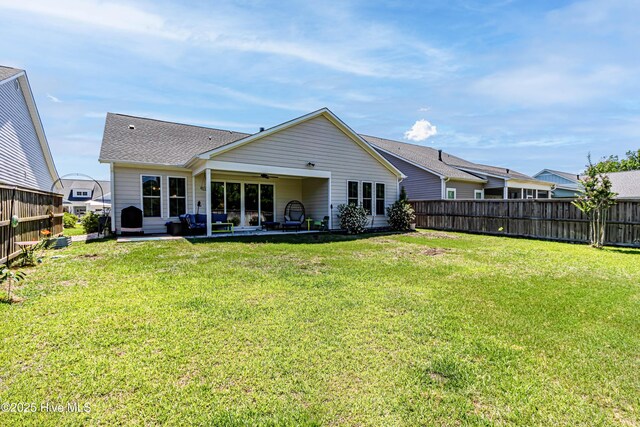 90 N Lamplighters Walk, Hampstead, NC 28443 - back of house featuring a ceiling fan and a patio area