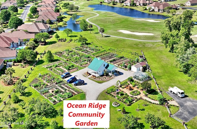 6575 Longwater Ct SW, Ocean Isle Beach, NC 28469 - aerial overview of property's location with a large body of water, nearby suburban area, and a golf course