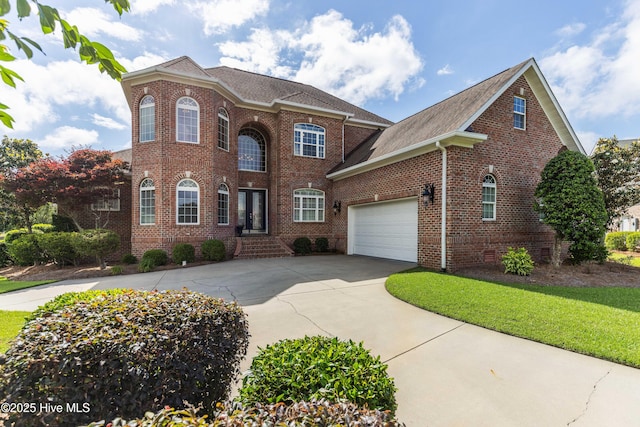 6575 Longwater Ct SW, Ocean Isle Beach, NC 28469 - colonial-style house with brick siding, driveway, a garage, and a shingled roof