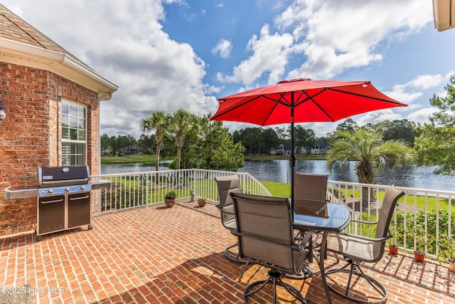 6575 Longwater Ct SW, Ocean Isle Beach, NC 28469 - view of patio featuring a grill and a water view