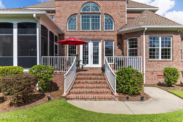 6575 Longwater Ct SW, Ocean Isle Beach, NC 28469 - entrance to property featuring brick siding and a shingled roof