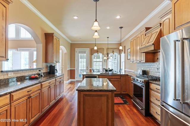 6575 Longwater Ct SW, Ocean Isle Beach, NC 28469 - kitchen featuring stainless steel appliances, a peninsula, a sink, tasteful backsplash, and recessed lighting