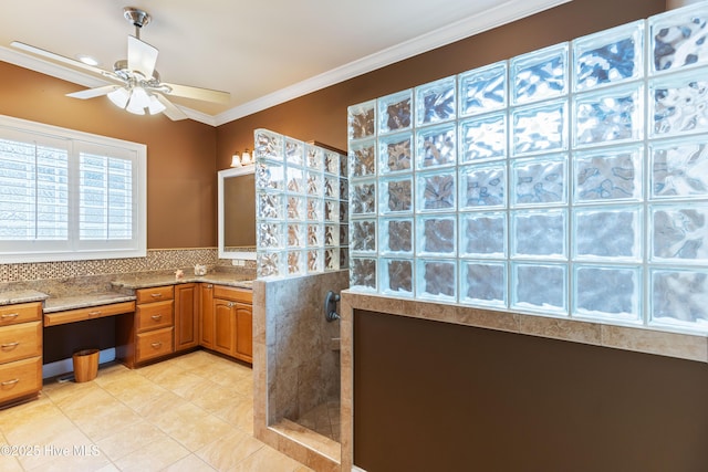 6575 Longwater Ct SW, Ocean Isle Beach, NC 28469 - bathroom with walk in shower, a ceiling fan, crown molding, vanity, and tile patterned floors