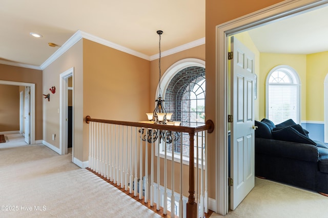 6575 Longwater Ct SW, Ocean Isle Beach, NC 28469 - hall with carpet, crown molding, healthy amount of natural light, a chandelier, and baseboards