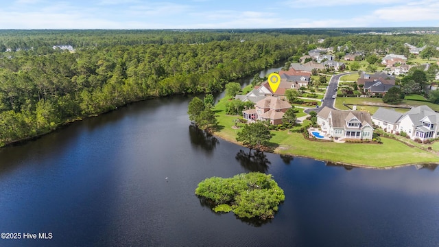 6575 Longwater Ct SW, Ocean Isle Beach, NC 28469 - aerial view of property and surrounding area with a forest, a large body of water, and nearby suburban area