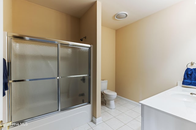 6575 Longwater Ct SW, Ocean Isle Beach, NC 28469 - bathroom featuring tile patterned floors, toilet, enclosed tub / shower combo, baseboards, and vanity