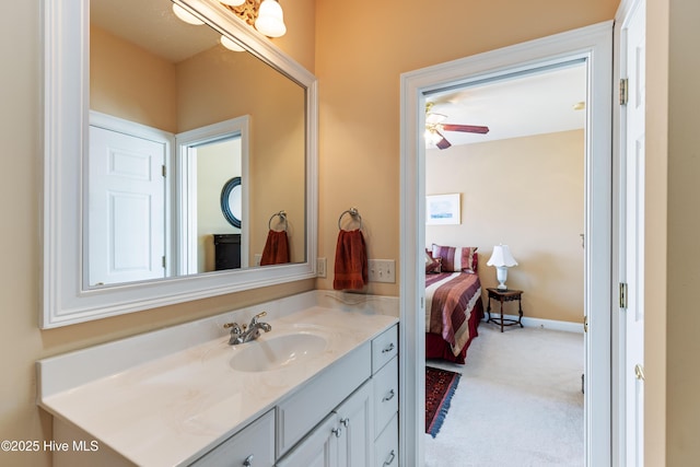 6575 Longwater Ct SW, Ocean Isle Beach, NC 28469 - bathroom with vanity, ceiling fan, and ensuite bathroom