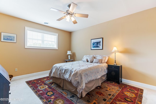 6575 Longwater Ct SW, Ocean Isle Beach, NC 28469 - carpeted bedroom with baseboards and ceiling fan