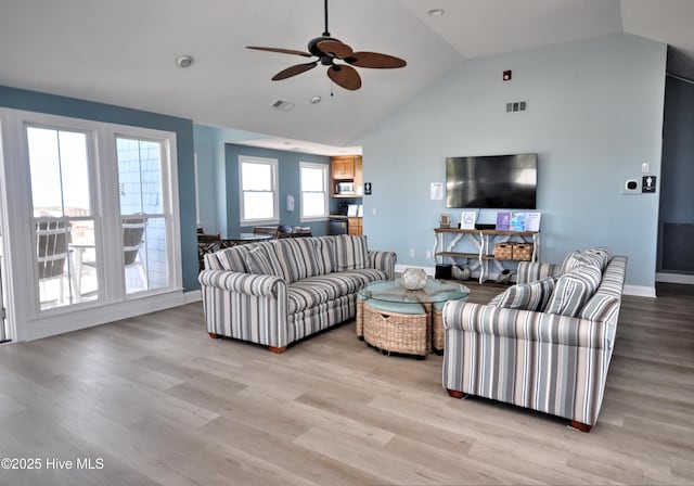 6575 Longwater Ct SW, Ocean Isle Beach, NC 28469 - living area featuring high vaulted ceiling, ceiling fan, light wood-style floors, and baseboards