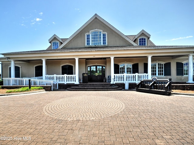 6575 Longwater Ct SW, Ocean Isle Beach, NC 28469 - view of front facade featuring a porch and stucco siding