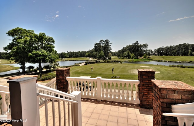 6575 Longwater Ct SW, Ocean Isle Beach, NC 28469 - view of patio / terrace featuring a water view, golf course view, and view of scattered trees