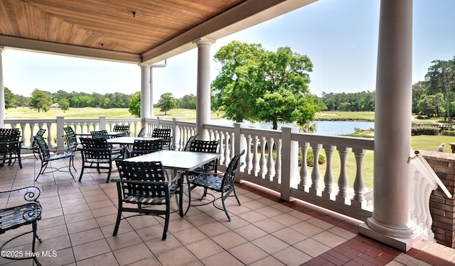 6575 Longwater Ct SW, Ocean Isle Beach, NC 28469 - view of patio featuring outdoor dining space, a water view, view of scattered trees, and view of golf course