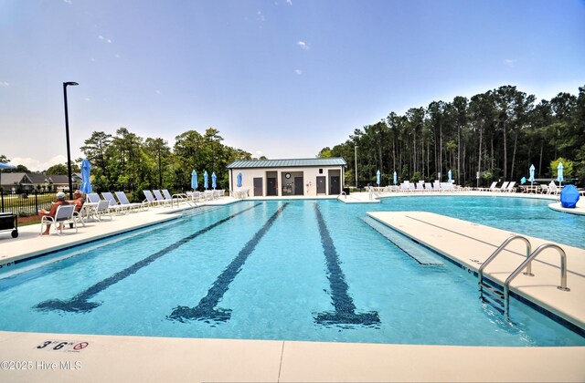 6575 Longwater Ct SW, Ocean Isle Beach, NC 28469 - community pool featuring fence and a patio