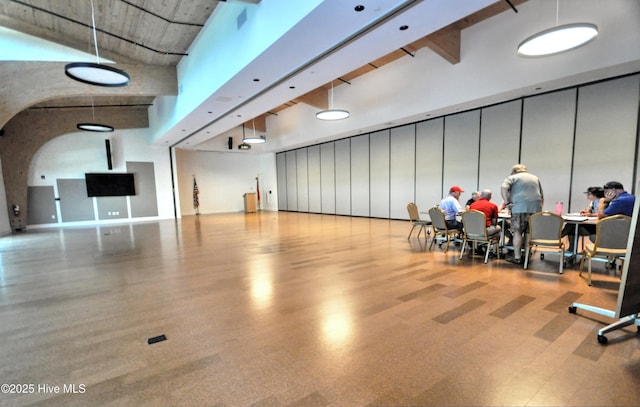 6575 Longwater Ct SW, Ocean Isle Beach, NC 28469 - miscellaneous room featuring a towering ceiling and arched walkways
