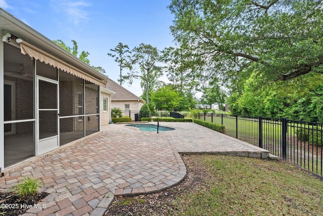 view of patio with a sunroom and a fenced backyard