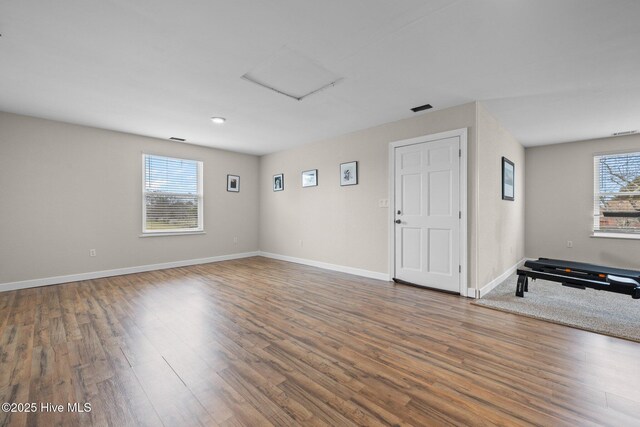 101 Mallard Dr, Currituck, NC 27929 - empty room with wood finished floors, baseboards, and attic access