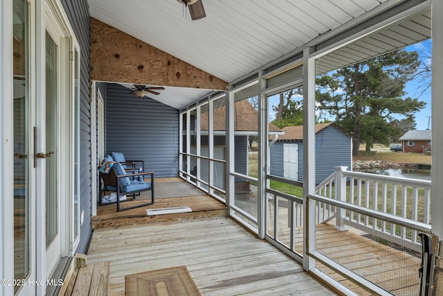 101 Mallard Dr, Currituck, NC 27929 - unfurnished sunroom with vaulted ceiling, a water view, and a ceiling fan