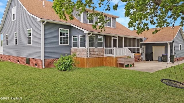 101 Mallard Dr, Currituck, NC 27929 - back of house with a sunroom, roof with shingles, a patio, and a yard