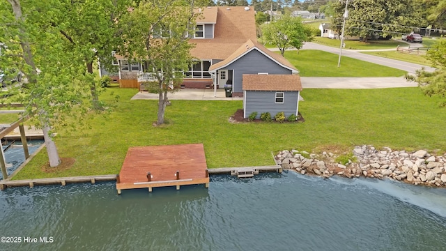 101 Mallard Dr, Currituck, NC 27929 - rear view of property featuring an outdoor structure, a sunroom, a water view, and a yard