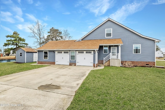 101 Mallard Dr, Currituck, NC 27929 - view of front of house with crawl space, an attached garage, driveway, and a front yard