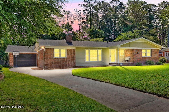 509 Decatur Dr, Wilmington, NC 28403 - single story home featuring a chimney, driveway, brick siding, and an attached garage