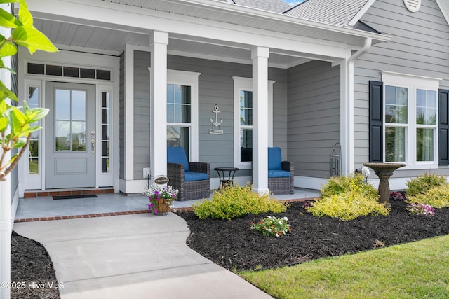 3032 Beachcomber Dr, Southport, NC 28461 - view of exterior entry with a porch