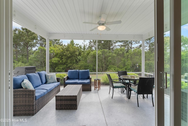 3032 Beachcomber Dr, Southport, NC 28461 - sunroom / solarium with a ceiling fan, outdoor lounge area, outdoor dining area, and healthy amount of natural light