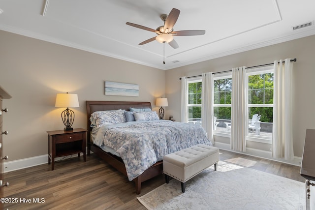 3032 Beachcomber Dr, Southport, NC 28461 - bedroom featuring wood finished floors, ornamental molding, baseboards, and a ceiling fan