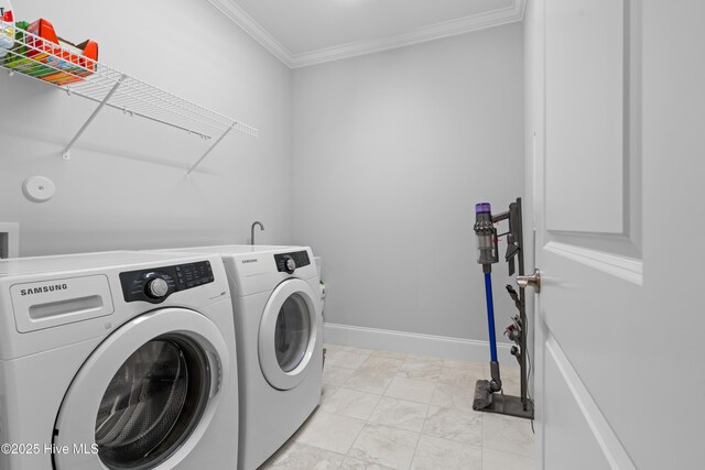 3032 Beachcomber Dr, Southport, NC 28461 - clothes washing area featuring washing machine and dryer, light marble finish flooring, ornamental molding, and baseboards