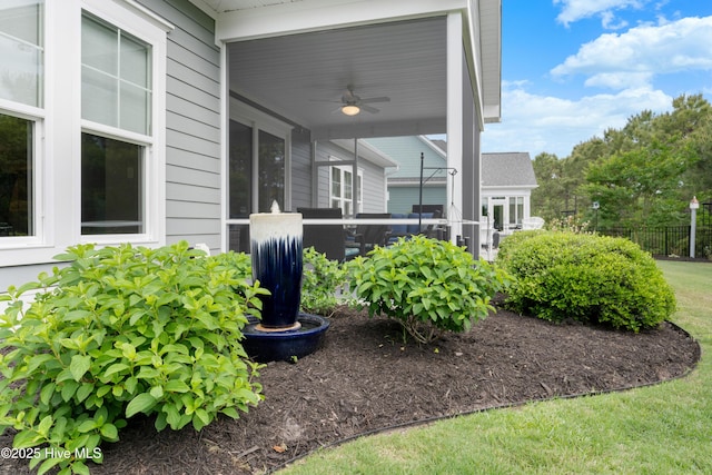 3032 Beachcomber Dr, Southport, NC 28461 - view of yard with a ceiling fan and fence