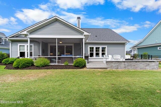 3032 Beachcomber Dr, Southport, NC 28461 - rear view of property with a sunroom, a chimney, and a patio area
