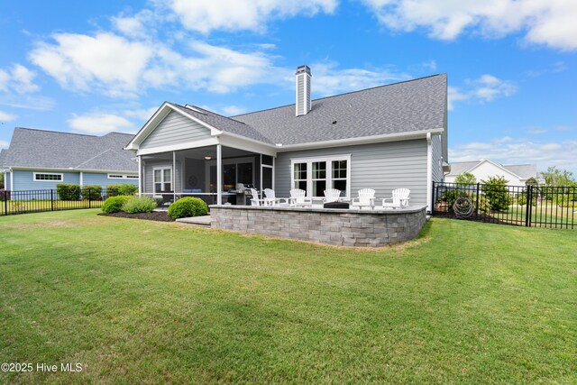 3032 Beachcomber Dr, Southport, NC 28461 - rear view of property with a sunroom, a chimney, a shingled roof, and a patio